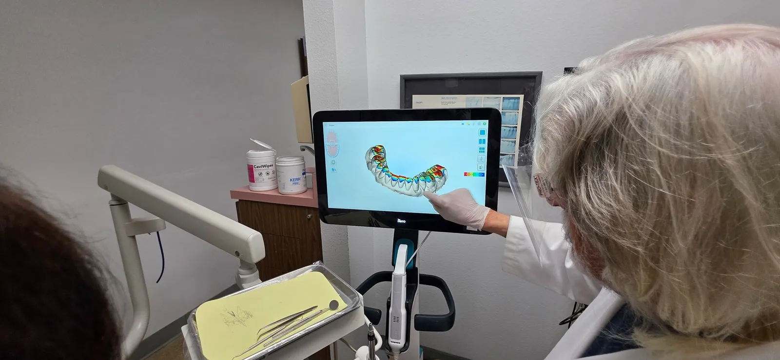 HB Dentist using digital impression scan technology for patient care