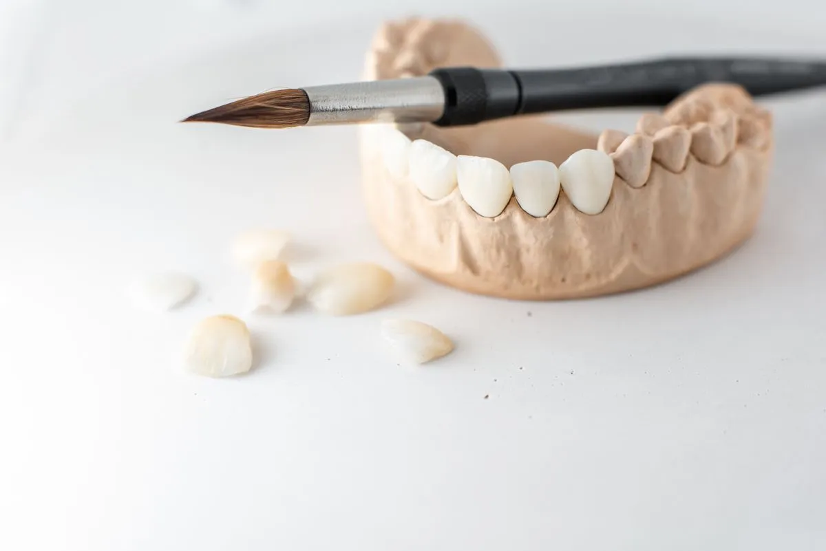 Dentist fitting a custom dental crown
